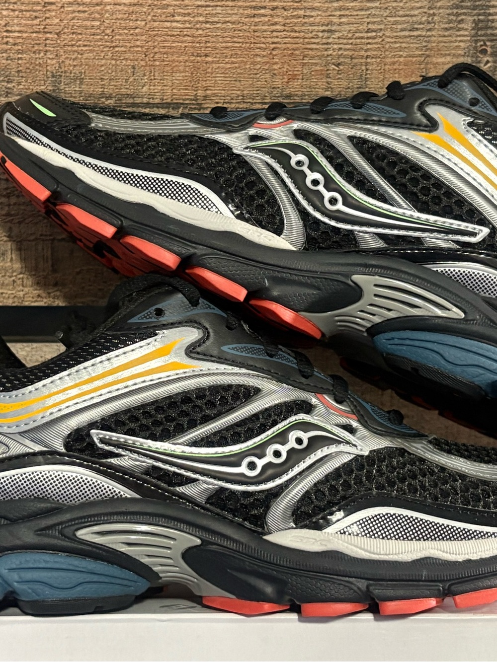 Saucony Men’s Black Athletic Running Shoes with Yellow and Coral Accents